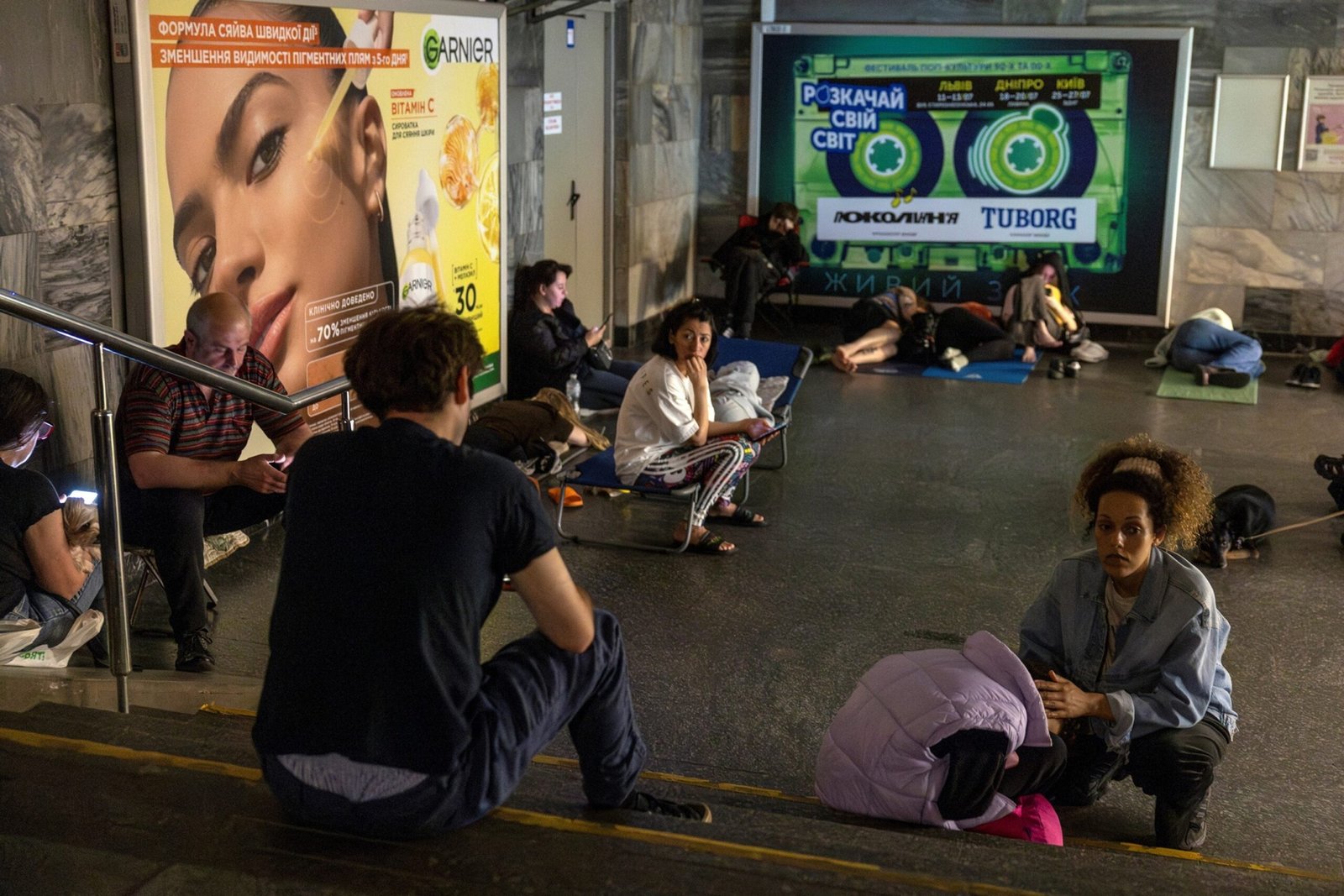 Photo: People take refuge in a subway station during a Russian drone attack in Kyiv