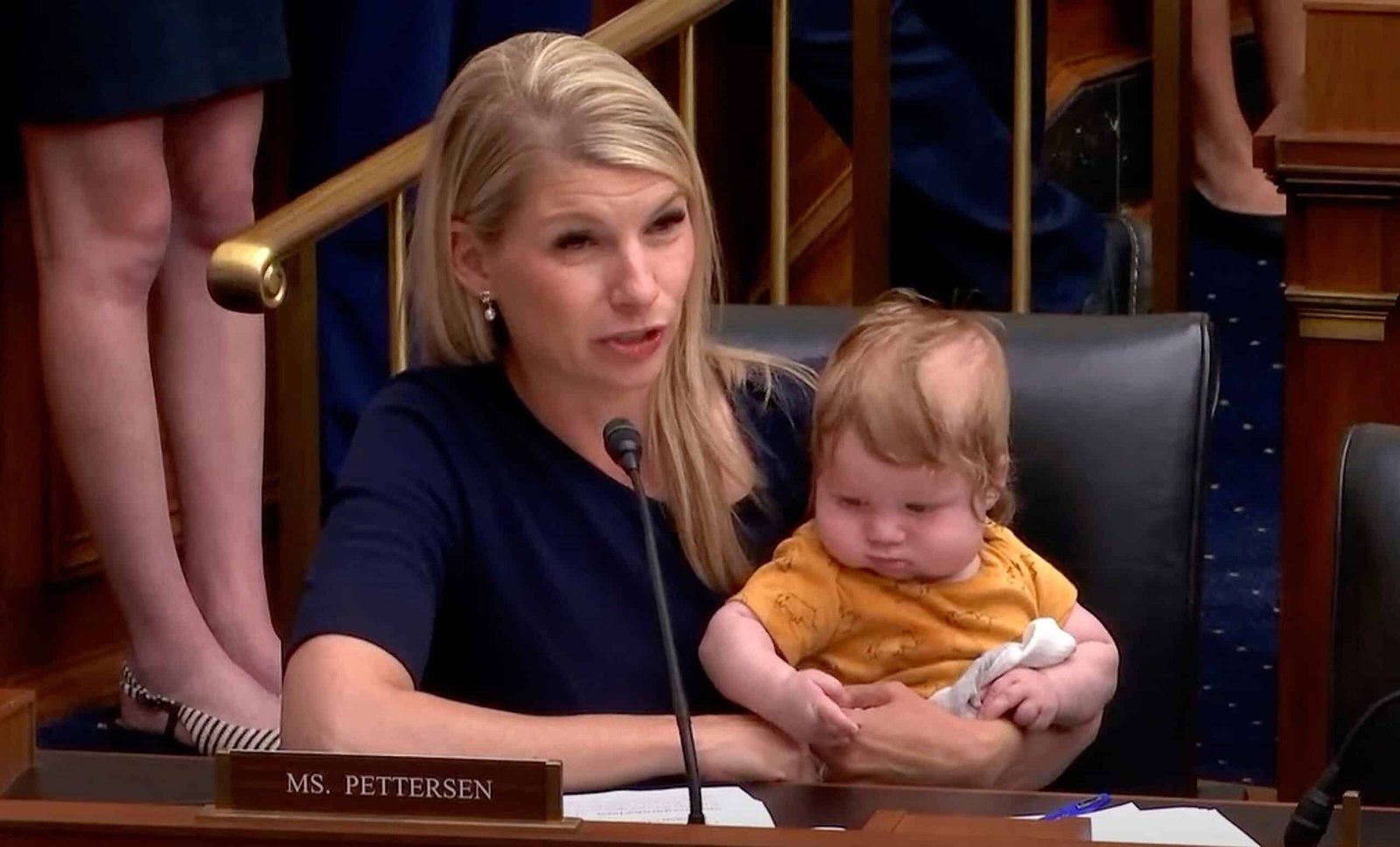 The Petterson representative brings Baby Son as he asks the president of the Fed Hearing at the audience