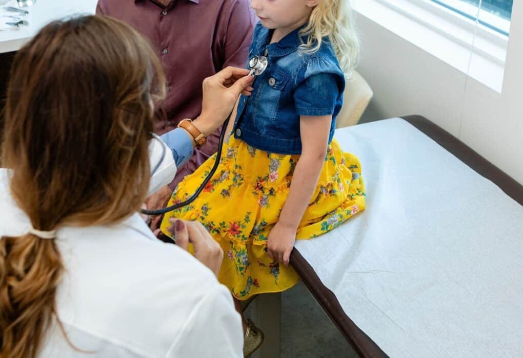 How soon will you feel the effects of Trump’s Megabill? Photo: A doctor reviews a child in an office in a file photo without date.